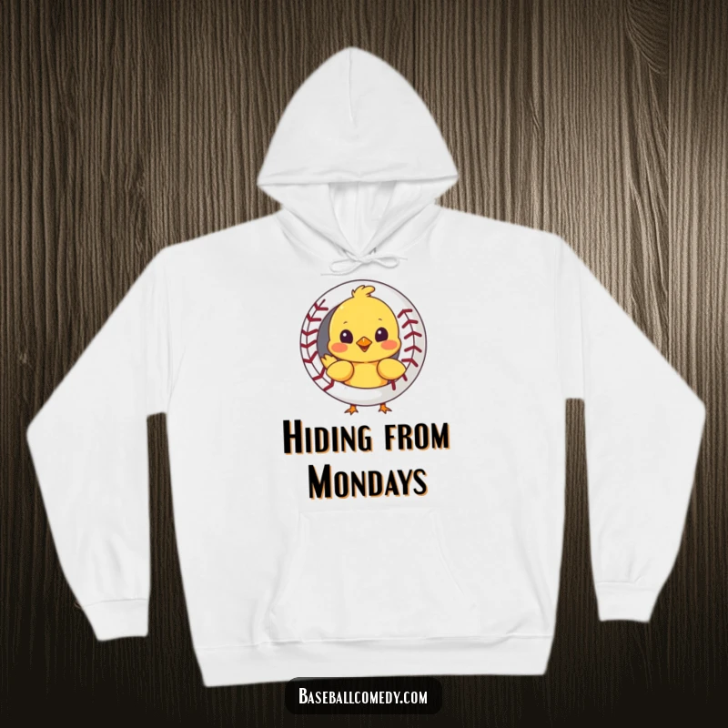 Funny hoodie with a curious chick peeking out from behind a baseball, offering warmth and a touch of humor.