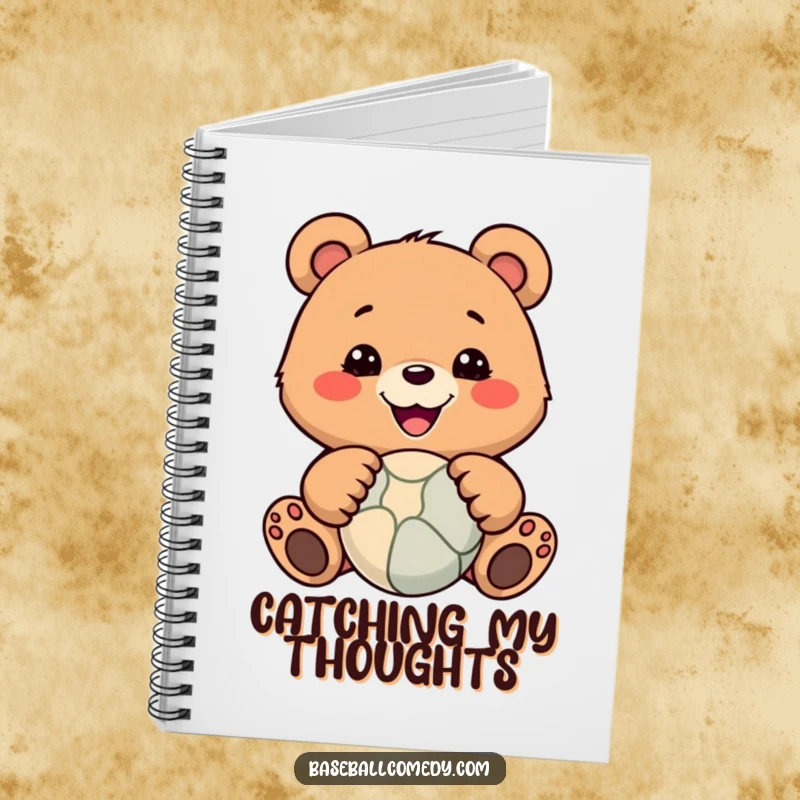 Funny notebook with a smiling bear catching a ball, perfect for jotting down notes or doodles with a humorous touch.