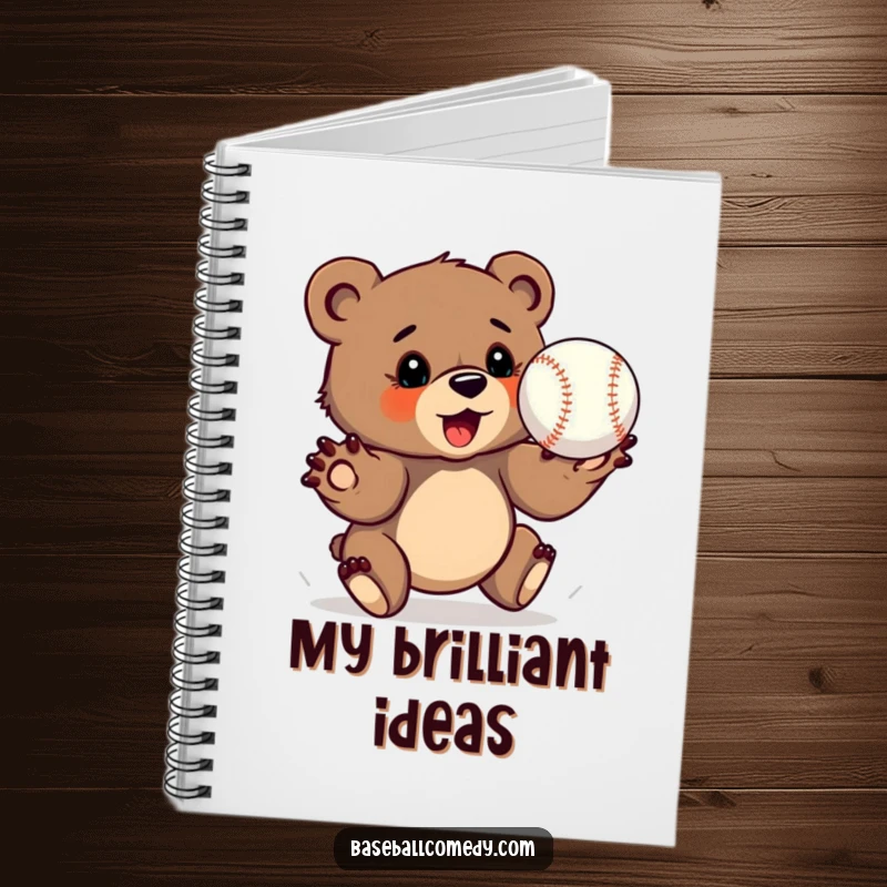 Funny bear cub notebook, determinedly catching a baseball with outstretched paws, perfect for focused writing.