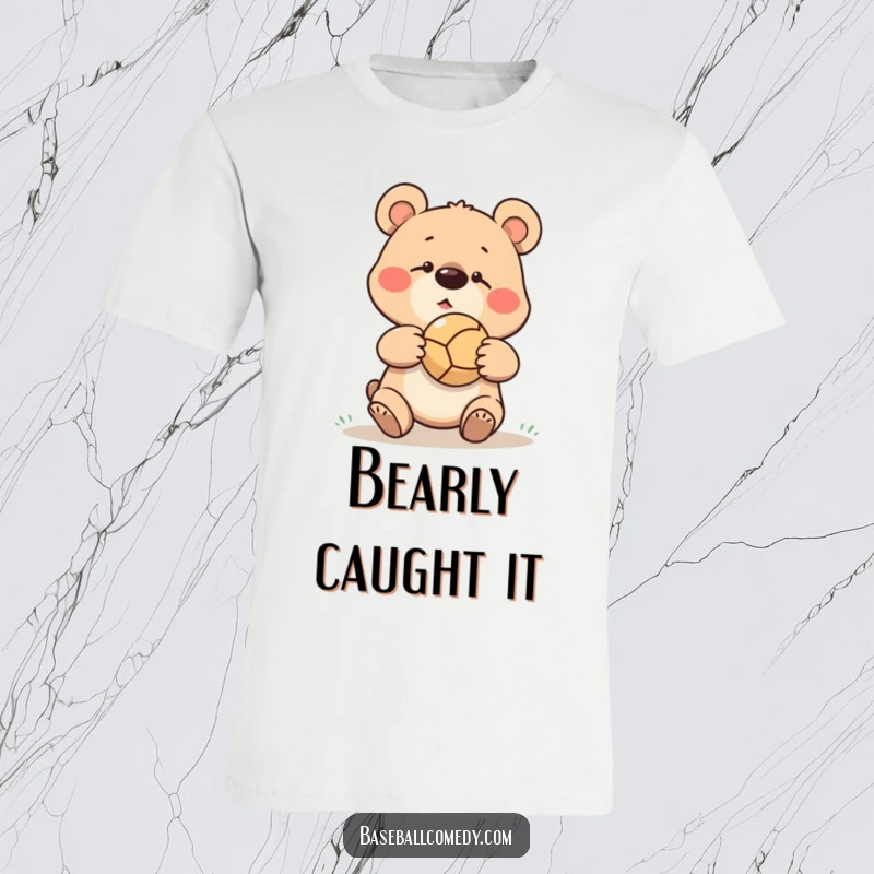 Funny goofy bear missing a baseball catch, ball bouncing off its nose, printed on a humorous t-shirt.