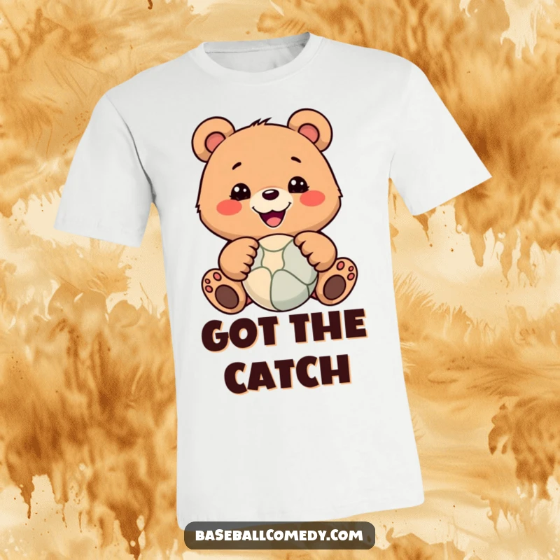 Funny t-shirt showing a happy bear with paws outstretched, catching a ball in a dynamic, humorous pose.
