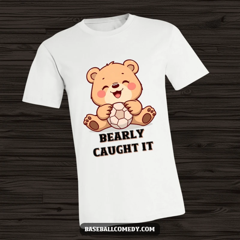 Funny bear t-shirt showing a happy bear skillfully catching a baseball with its paws, conveying playful and athletic humor.