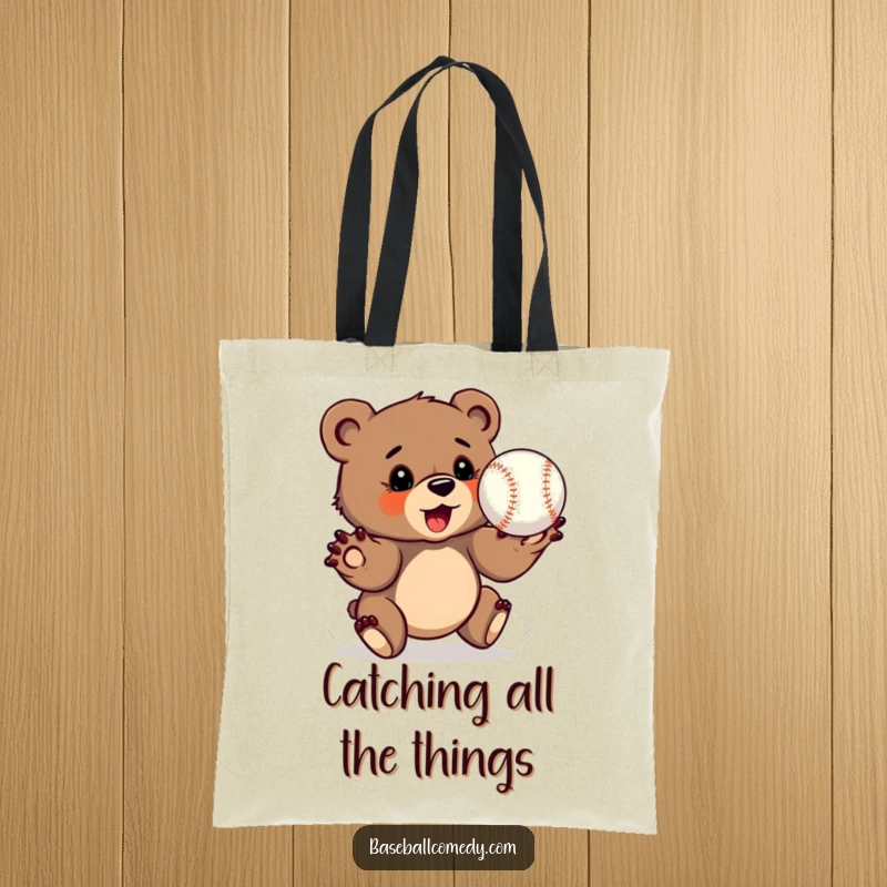 Funny bear cub tote bag, determinedly catching a baseball with outstretched paws, carrying essentials.